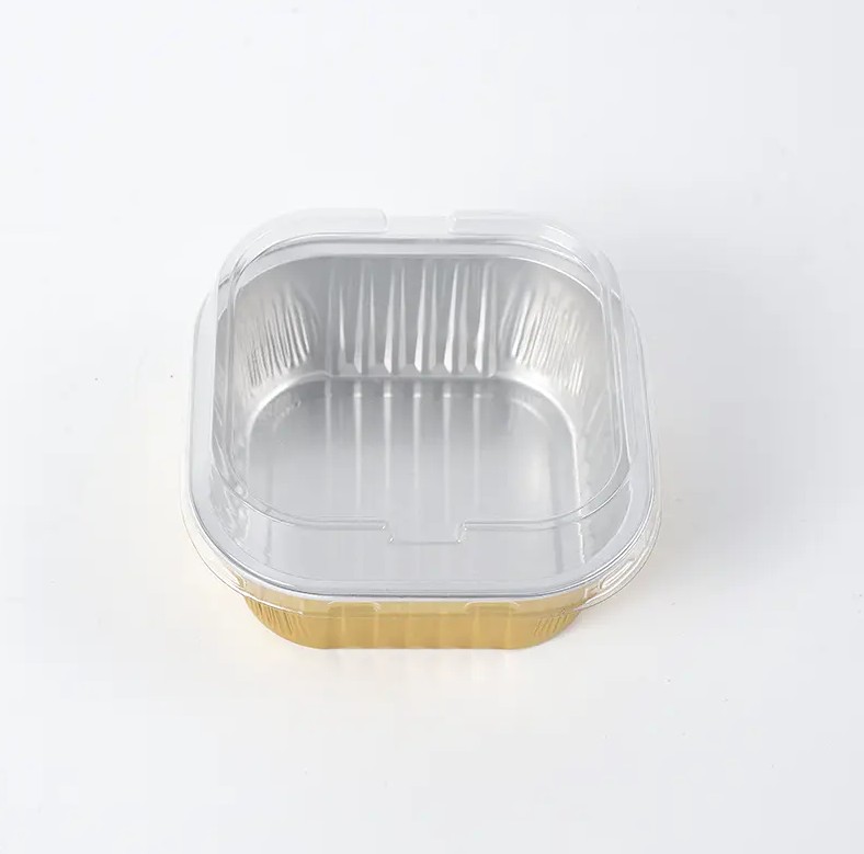 Hur realiseras den skrynkelsäkra designen av Square Wrinkle-Free Aluminium Foil Food Container under produktionsprocessen, och vilken inverkan har det på användningen av behållaren?